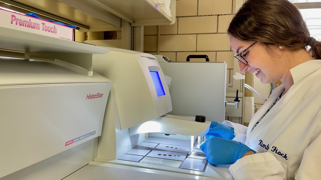 Kimberly working with some lab equipment